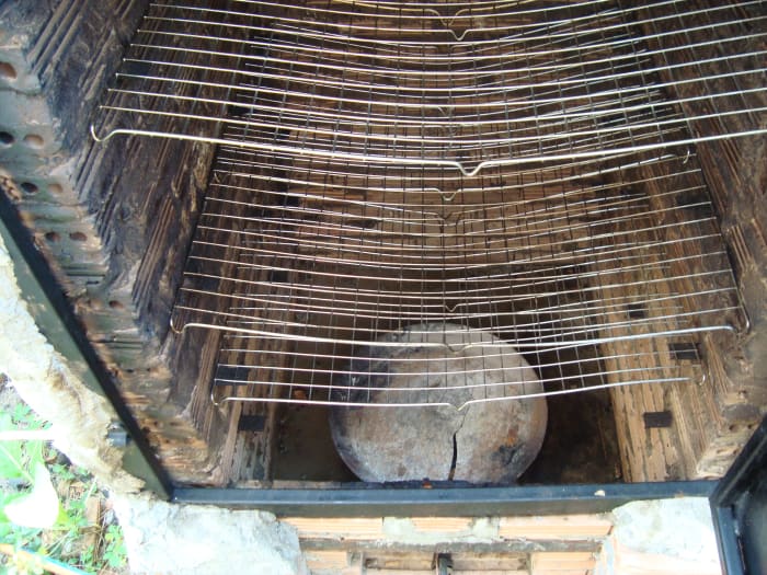 You can see the little metal shims that are embedded in the mortar between the bricks to serve a grill supports