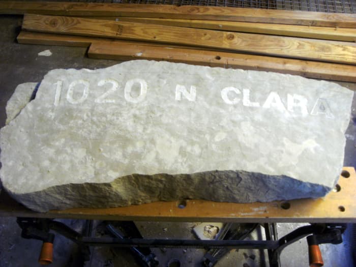 Stone slab to be made into a sign. Engraving has been started already.