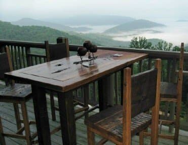 This rustic bar table and stools were built from the large reclaimed wormy chestnut board you see above.