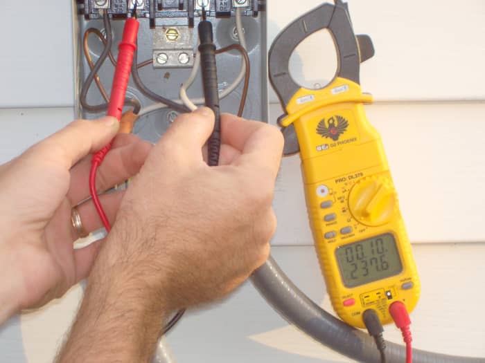 Here the "line" is being tested. The "leads" are what I'm holding here and the "lug" is what I'm touching them to. You can see the voltage reading here.
