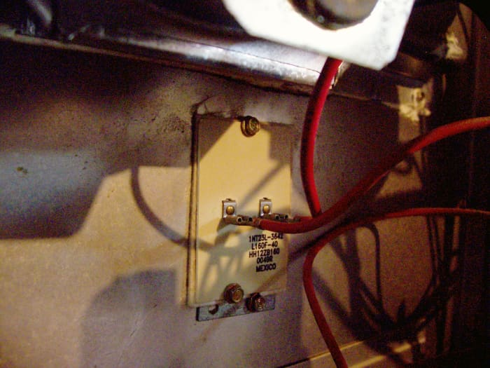 This high-limit switch is not adjustable. Older switches had a dial that could be adjusted, which in reality was not a good idea.