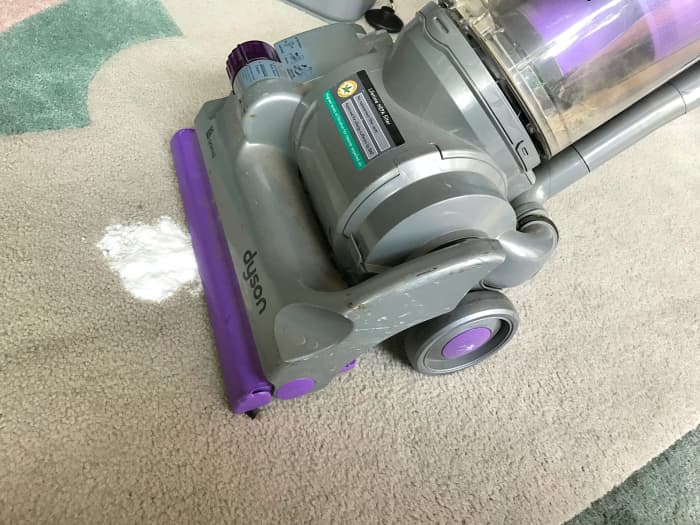 Vaccum the area once the baking powder is dry.
