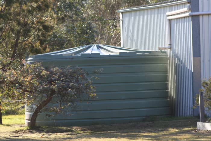 The size of the water storage tank is largely determined by the size of the water catchment area. A large roof area is worthy of a large tank if you can afford it. Look for tank sales at the end of the financial year.