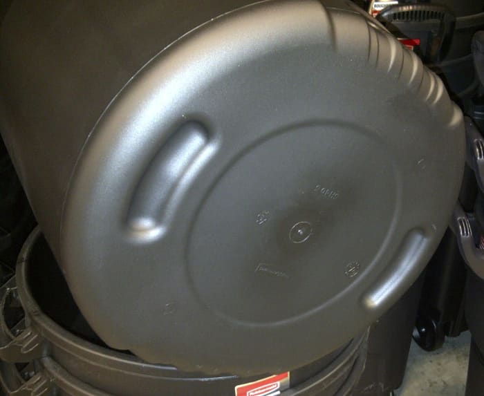 This plastic garbage can will wear holes in the bottom quickly if you drag it across a rough surface.