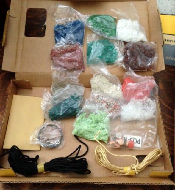 Kit contains imported mosaic tiles, beads, braids, colorful stones and sparkling colored glass All to be crafted on textured fabric, trimmed with a 8 1/2" X 24" grained-styled frame.