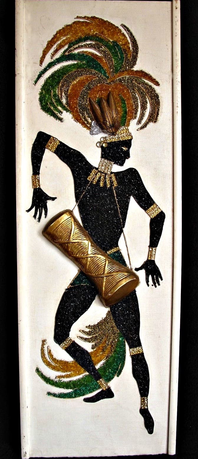 Early 1960s mid-century modern gravel Art native dancer with drum. Incorporates real feathers and jewels Drum is high relief. 36.5" x 13"