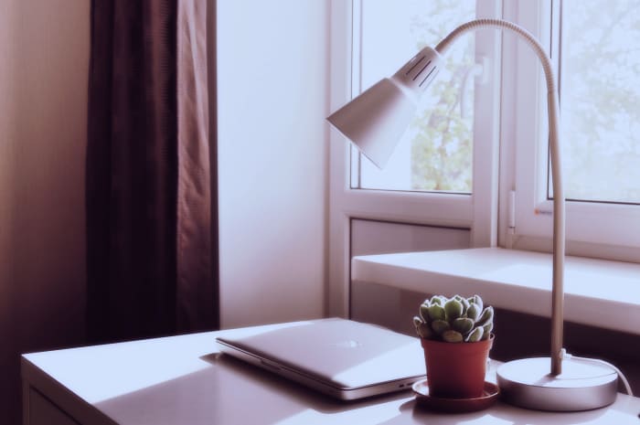 Working under natural daylight is so much nicer than working under bright office lights. Make sure that you also have good task lighting for when you are working in the evening or on dark, gray winter days.