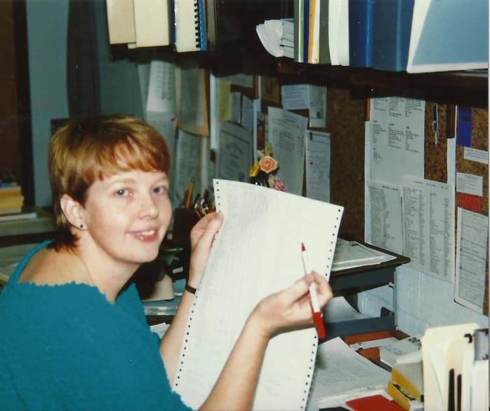 My work style is all-out. You can see from this photo of me, some years ago, that I'm a paper hoarder. I'm trying to cut back on that.