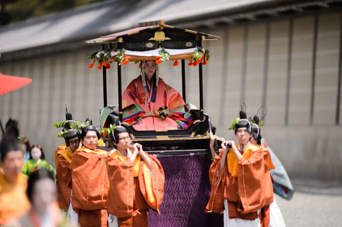 In the modern era, a different unmarried woman from Kyoto is picked each year to serve as Saio (high priestess of the Kamo Shrines), who is carried in the festival on a palanquin.