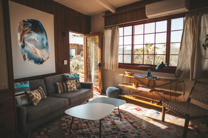The living room is a high-traffic area that can accumulate carpet smells, spilled food smells, and definitely stinky shoes by the front door smells.