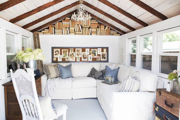 A comfortable sectional, pillows and lots of natural light make a bright and cozy nook to spend time alone.