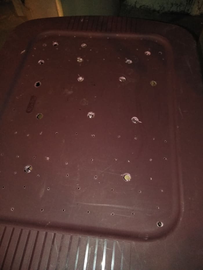 Holes drilled in the lid of the tote.