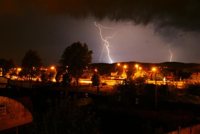 Thunderstorm landscape with a lightning bolt. Storms often cause power outages. It's best to be prepared when it happens.