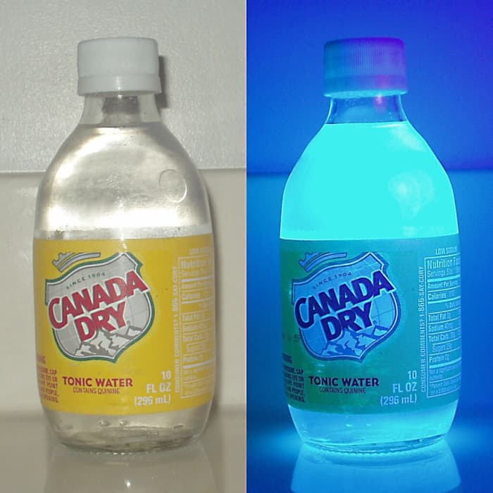 Tonic water contains quinine. When ultraviolet light is shone on quinine, it fluoresces, releasing a blue light.