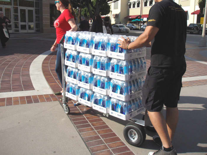 There's greater danger from bottled water leachates when the bottles are old or have been sitting in the hot sun for awhile. Cases like this are usually transported quickly from a refrigerated truck to shelves in the store to prevent that problem.