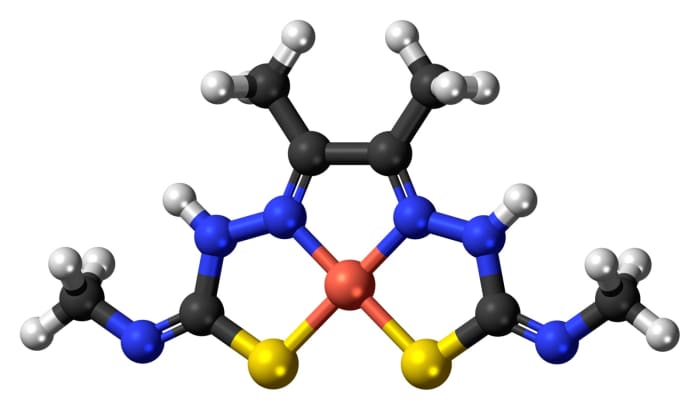 A model of Cu-ATSM; white = hydrogen, black = carbon, blue = nitrogen, yellow = sulphur, orange = copper