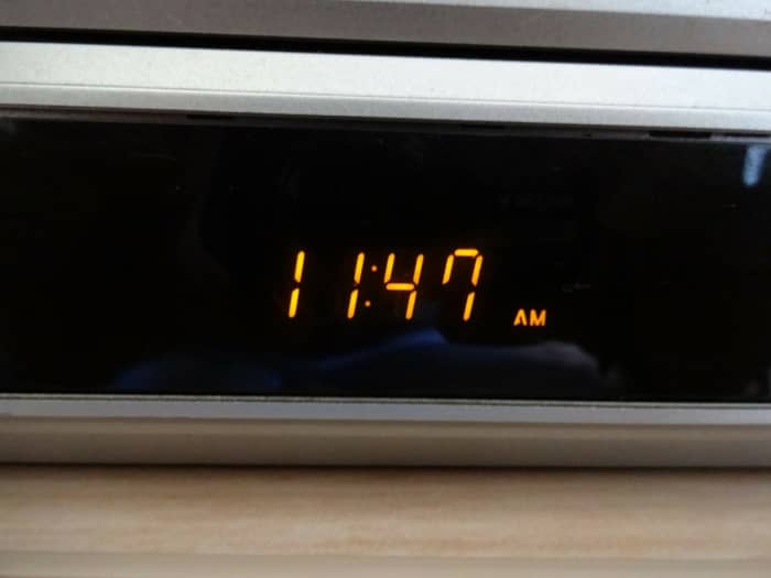 Alarm clocks can lead to anxious thoughts. The light from digital clocks is worse. If you need an alarm to wake you, put it under the bed, throw a scarf over it, or in a cupboard; somewhere you can't see it but will still hear it in the morning!