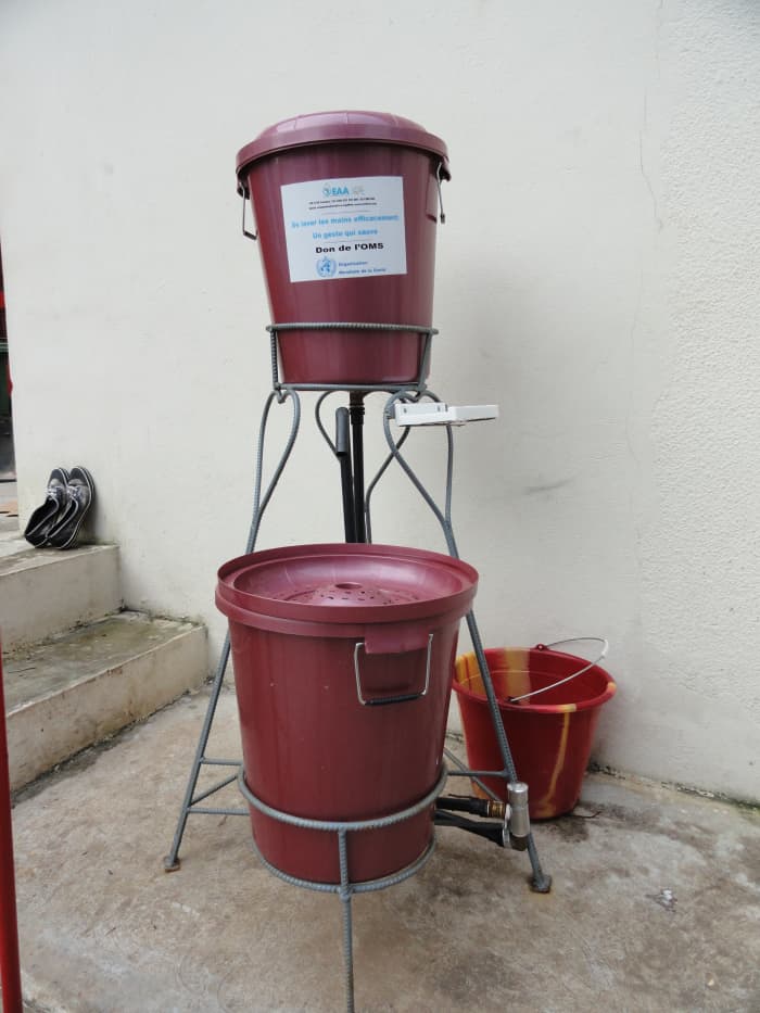 Handwashing station. These are filled with chlorinated water and can be found in various locations, such as entryways for hotel workers, WHO headquarters, and restaurants. CDC Global / CC BY (https://creativecommons.org/licenses/by/2.0)