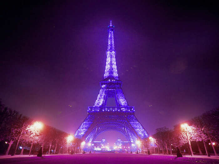 A desktop wallpaper photo showing the Eiffel Tower at night. Wallpaper websites show photos of lighted monuments as their background and some make money off them as well. Are they now copyright infringers?