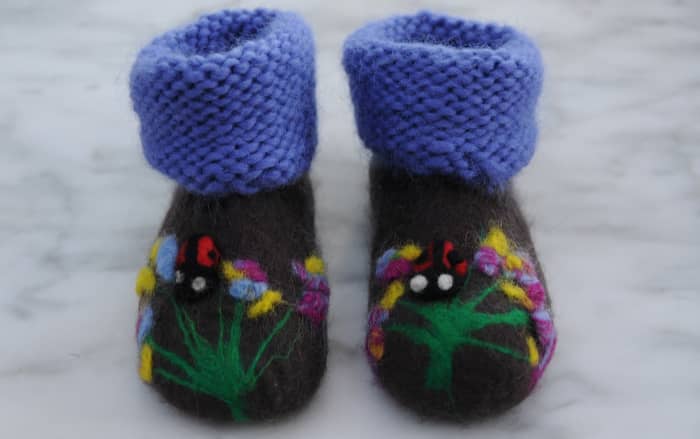 Here are the completed booties, a cute floral scene and a pair of needle felted ladybirds!