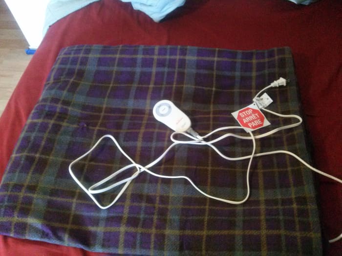 Electric throws come in all shapes and fabulous colors, so you don't have to get one that's purple/brown/silver plaid. They can also save money on your heating bill!