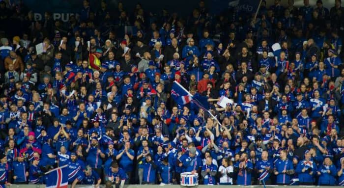 Fans celebrate following a 2018 World Cup qualification match between Iceland against Kosovo on Oct. 9, 2017, in Reykjavik. With a population of 330,000, Iceland became the smallest nation to qualify for a FIFA World Cup.
