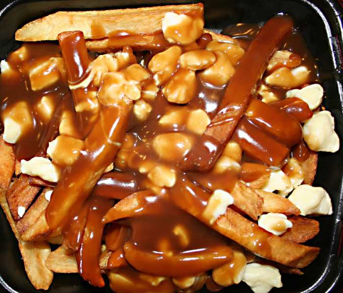 Poutine is a delicious mess made from French fries, cheese curds, and gravy.