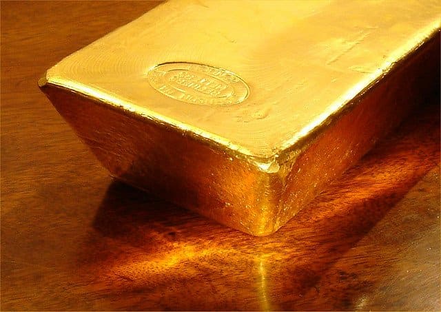 The stamp on this piece of gold could indicate what use it's intended for and how many, if any, other metals were added to it.
