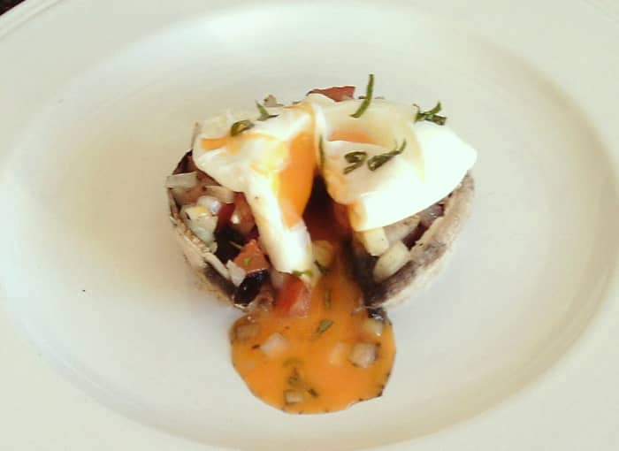 A breakfast themed tomato and onion stuffed portobello mushroom with poached egg is one of the recipes to be found on this page