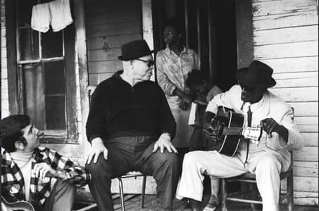 John "Piano Red" Williams (center with hat and sunshades) was an albino, African American, barrelhouse style pianist who played on Beale Street in Memphis, TN. He played in clubs for many years before his recording debut in1969.