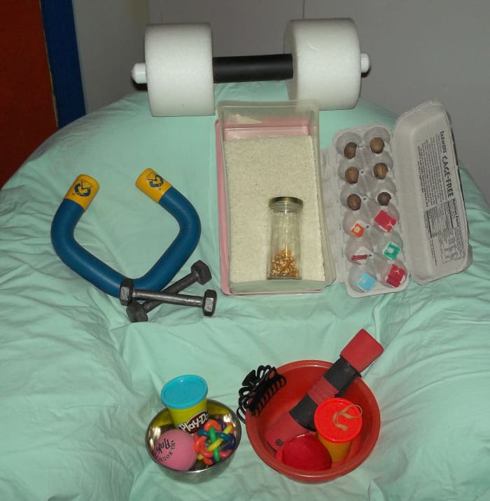 Here's my whole collection of DIY physical therapy tools! Some I already had in my kitchen; others I bought and others I had in my exercise gadget collection.