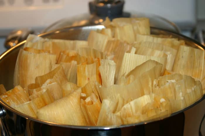 This is a recipe for homemade hot tamales. Here, a batch of tamales have just finished steaming in the pot.