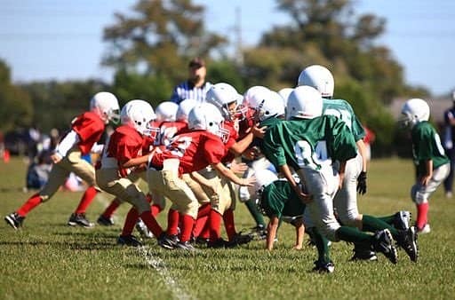 Youth football players playing a game at Camp Lejeune, North Carolina.