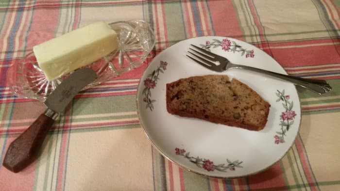 Banana walnut bread served warm with butter.