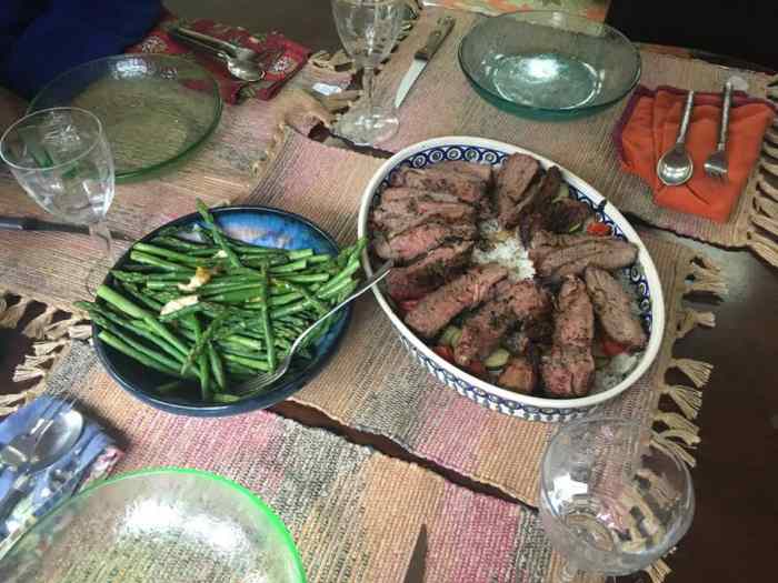 Seasoned lamb on a bed of vegetables and basil-butter rice 