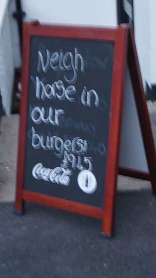 Sign outside a pub in England (this may account for the camera shake.)