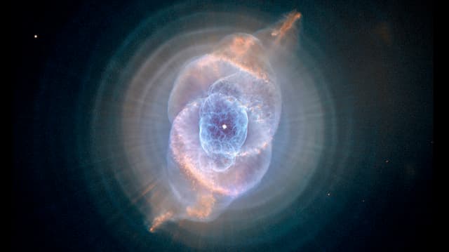 The Cat's Eye Nebula, one of the first planetary nebulae discovered, also has one of the most complex forms known to this kind of nebula