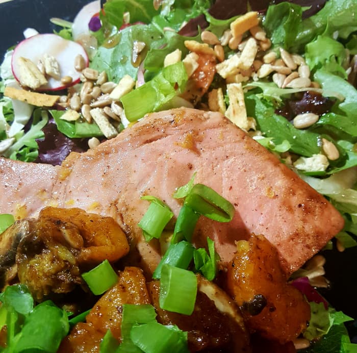 Wild-caught, certified sustainable yellowfin tuna steaks covered in seared tangerines, oranges, and golden beets and served over Asian greens with sesame oil salad dressing.