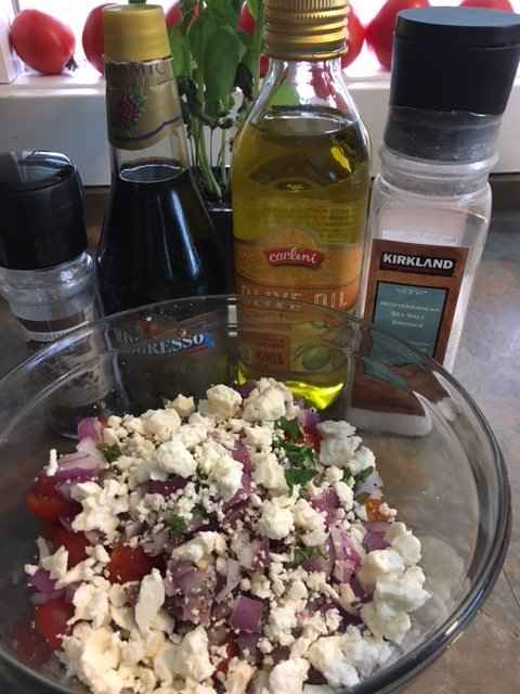 Pour blended olive oil and vinegar over tomatoes, mix gently, refrigerate for about an hour and enjoy!