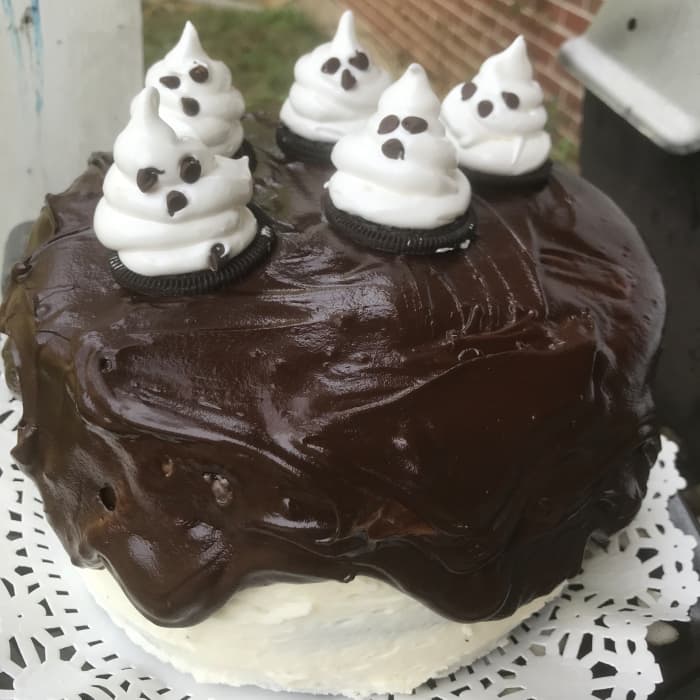 Luscious dark chocolate cake, simple buttercream, dark chocolate ganache, and homemade marshmallow ghosts make a perfect Halloween treat.
