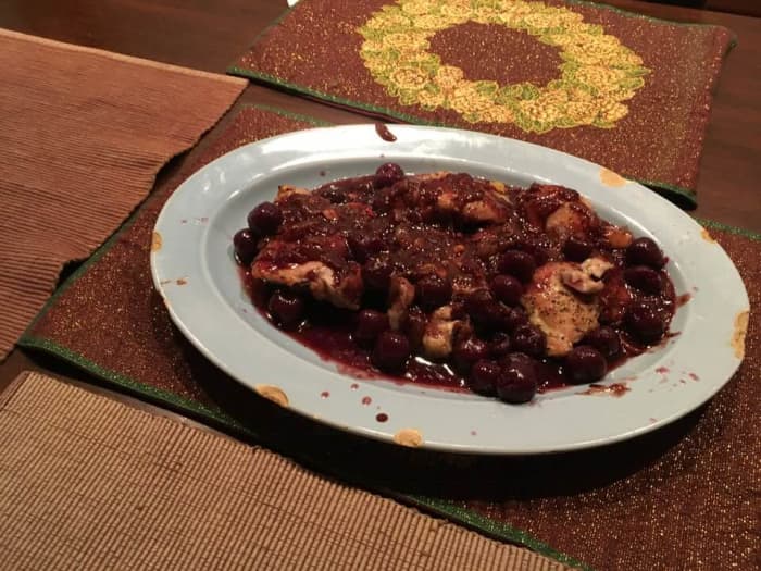 Learn how to make a succulent roasted chicken basted with honey, combined with a dark demi-glazed cherry sauce and reduced wine.