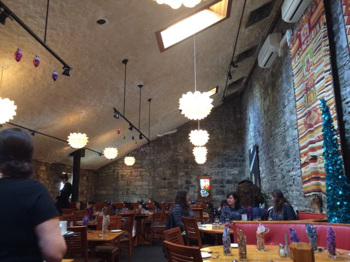 This is Chez Piggy's second-floor dining area where the atmosphere is bright, airy, and warm.