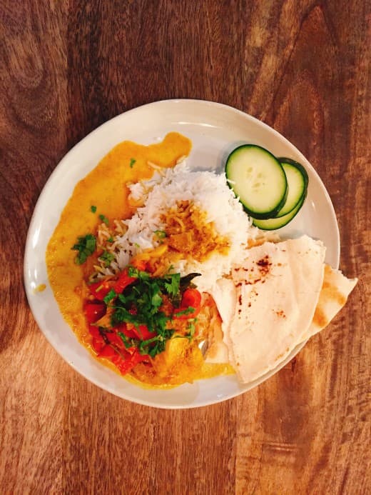 Malay cuisine incorporates many spices and local ingredients. This chicken curry calls for turmeric, curry powder, cardamom, star anise, cloves, garlic, shallot, and coconut milk.