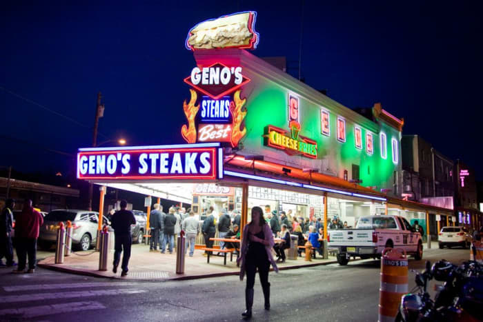 Geno's Steaks. The cheesesteak sandwich is one of my favorites, bar none. It features delicious slices of beef, topped with cheese, onions, and bell peppers—all served on a toasted bun. What more could you ask for?