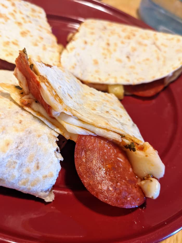 The pizzadilla is a truly customizable food. Shown above is a pizzadilla featuring pepperoni, ham, and pineapple.