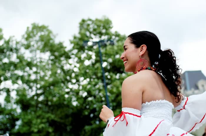 She's dancing to these 10 Spanish Songs About Overcoming Obstacles, Adversity, Hard Times, Challenges, and Not Giving Up.