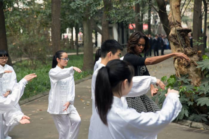 First Lady Michelle Obama participates in tai chi with students from Number 7 School in Chengdu, China on March 25, 2014.