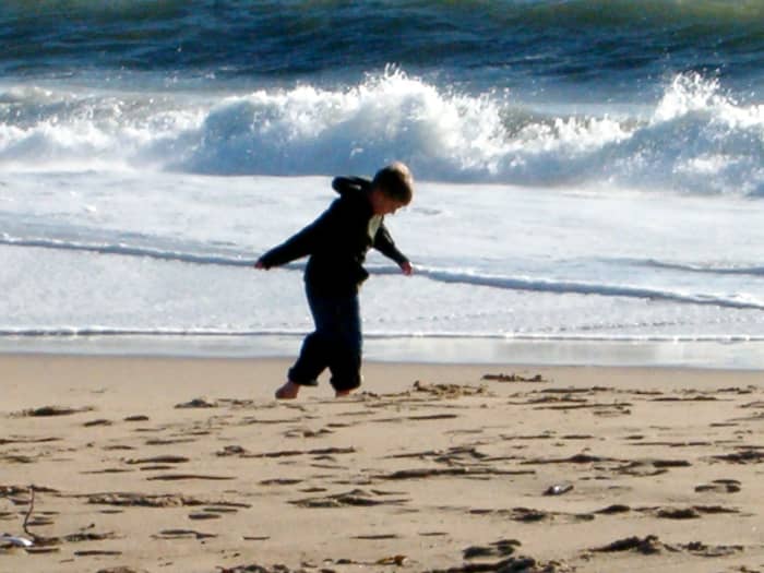 This my oldest son, waking into the wind near the ocean in January in Southern California one year. This is near the wedge in Balboa, Newport Beach.