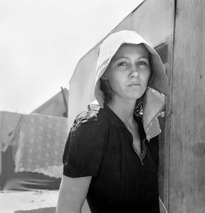From Wikimedia Commons: "Young migratory mother, originally from Texas. On the day before the photograph was made she and her husband traveled 35 miles each way to pick peas. They worked 5 hours each and together earned $2.25."