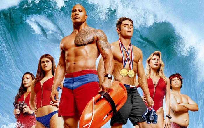 The cast of "Baywatch." From left to right: Ilfenesh Hadera, Alexandra Daddario, Dwayne Johnson, Zac Efron, Kelly Rohrbach, and Jon Bass.